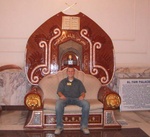 Mark Stickel sits on Saddam Hussein's "throne" at the Al Faw Palace in Baghdad, Iraq.  The palace, once Saddam's favorite getaway, is now the headquarters for coalition operations in Iraq.